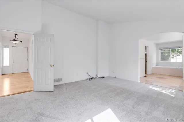 an empty room with windows