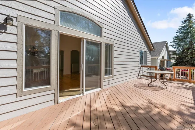 a view of a two chairs in the balcony