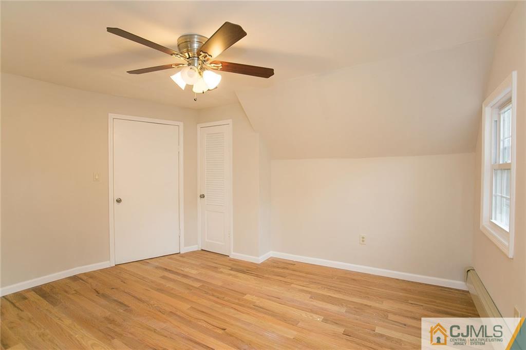 31 Parker Road Edison, NJ 08820 - Photo 14 of 25 a view of a room with a ceiling fan and a window