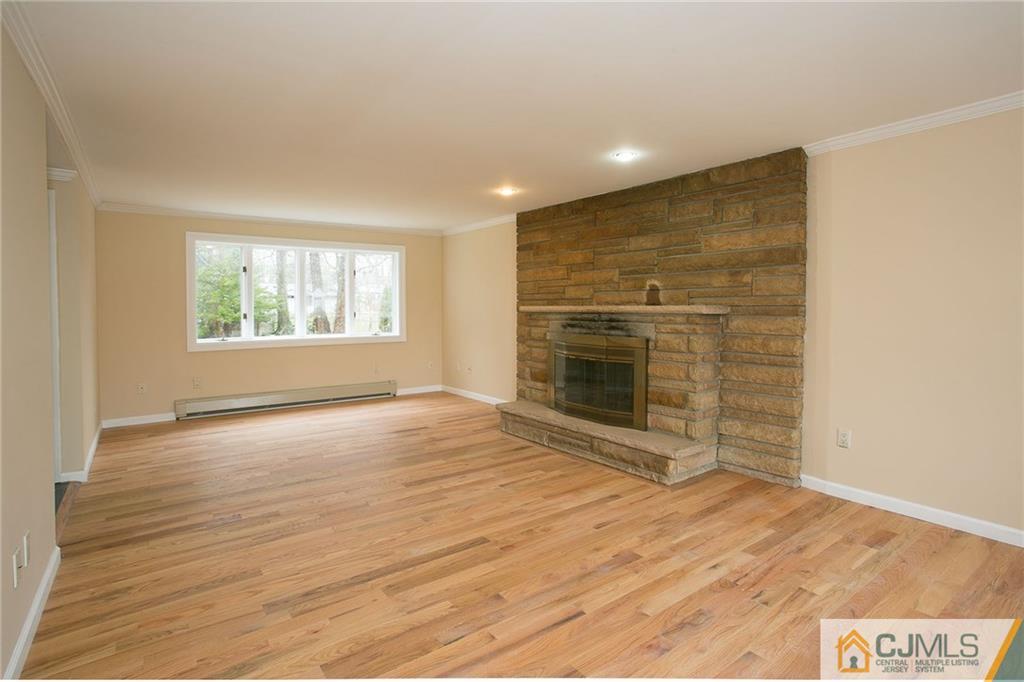 31 Parker Road Edison, NJ 08820 - Photo 3 of 25 a view of an empty room with a fireplace and a window