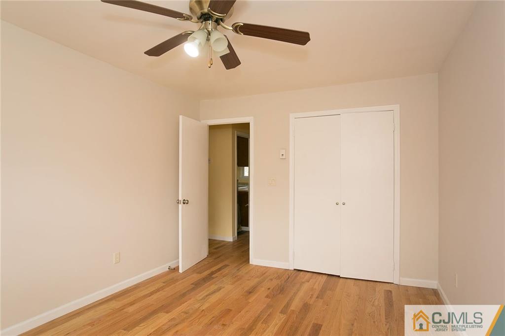 31 Parker Road Edison, NJ 08820 - Photo 22 of 25 a view of an empty room and wooden floor