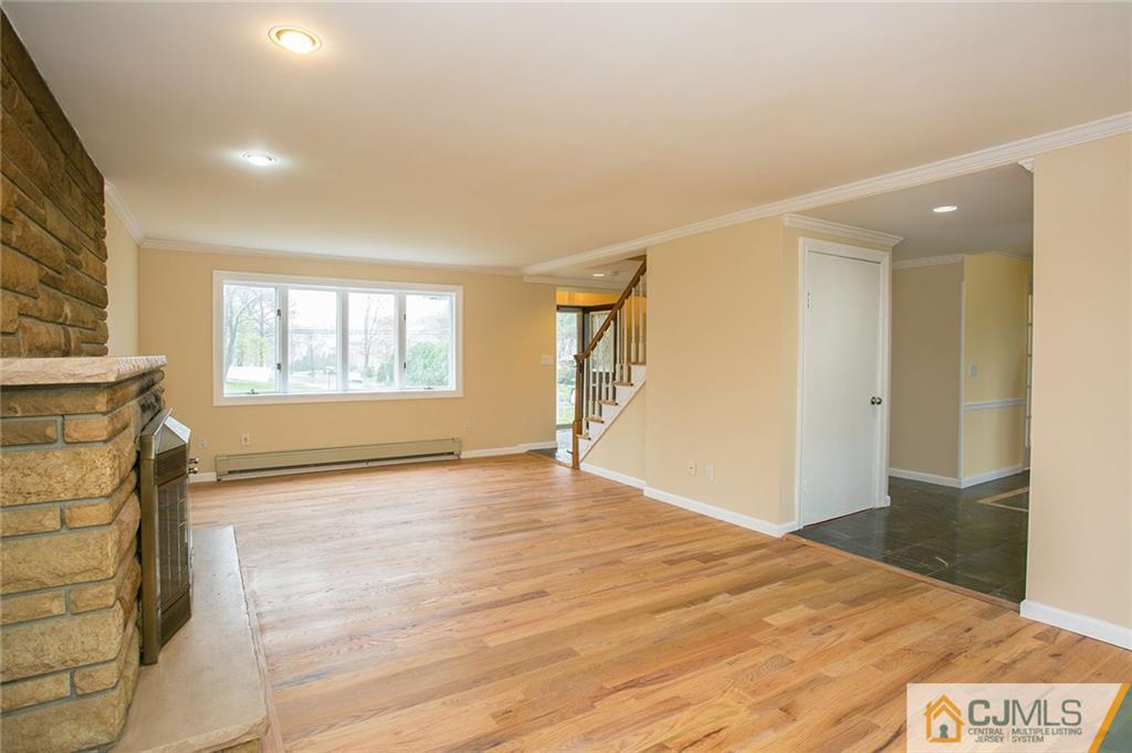31 Parker Road Edison, NJ 08820 - Photo 4 of 25 a view of an empty room with wooden floor and a window