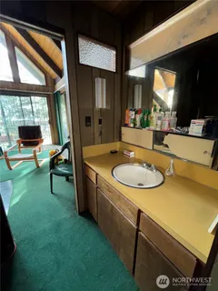 a room with furniture and a large window