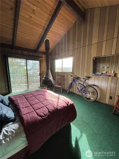 a bed sitting in a room next to a window