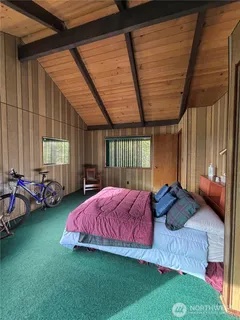 a bed room with furniture and a window