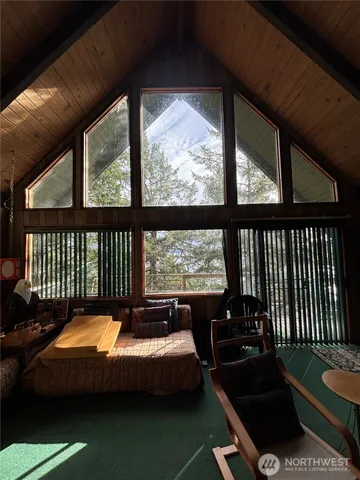a view of a balcony with furniture
