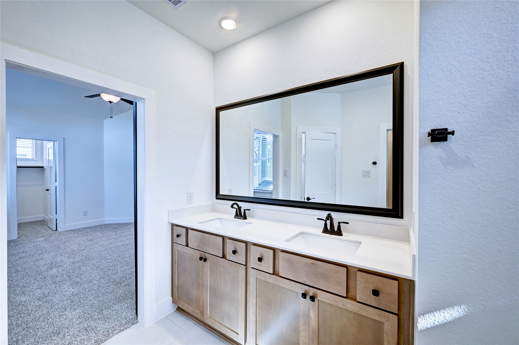 7643 Meadow Mouse Lane Katy, TX 77493 - Photo 21 of 35 a bathroom with a sink and a mirror