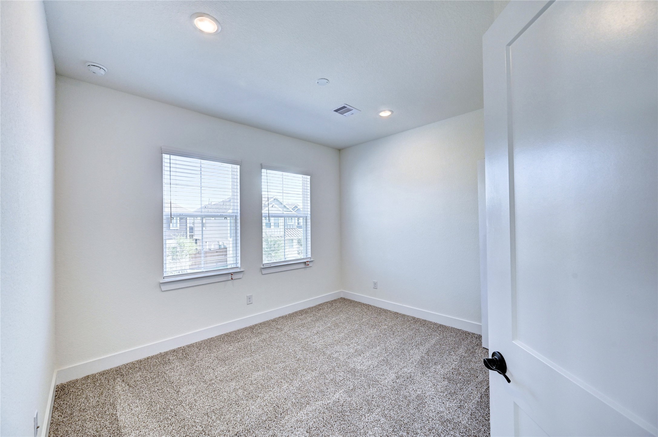 7643 Meadow Mouse Lane Katy, TX 77493 - Photo 28 of 35 an empty room with windows