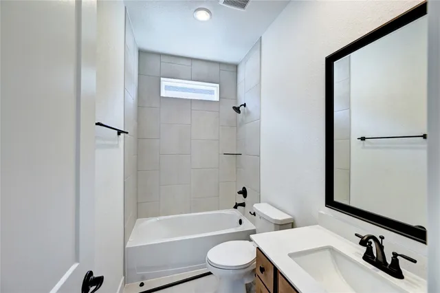 a front view of a house with outdoor seating