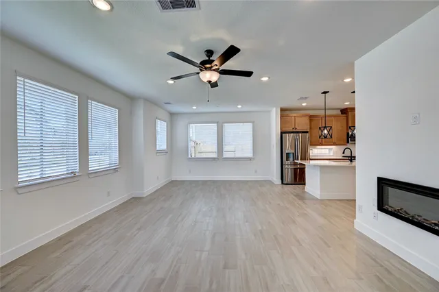 a view of a kitchen with wooden floor and a kitchen