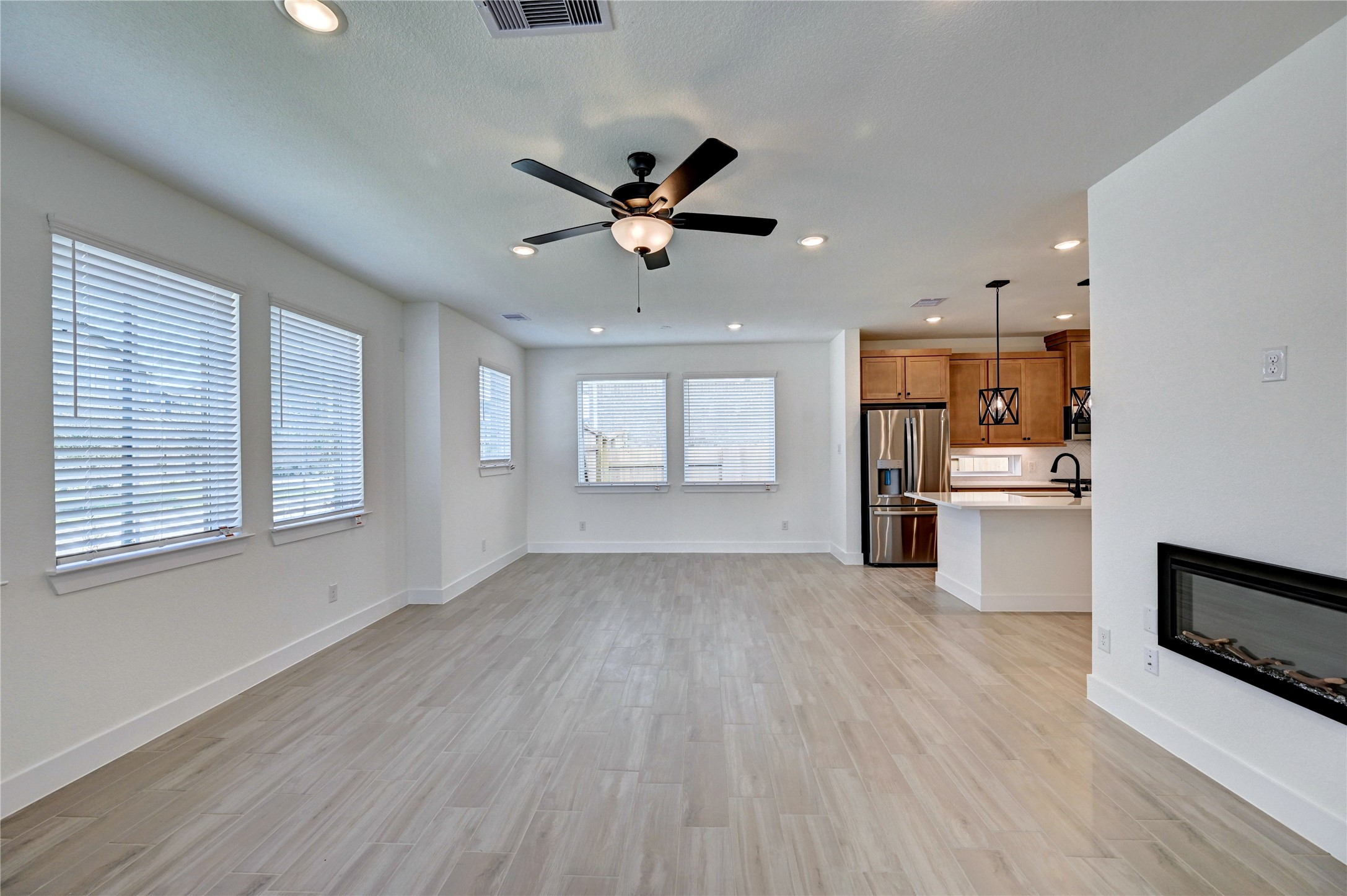 7643 Meadow Mouse Lane Katy, TX 77493 - Photo 6 of 35 a view of a kitchen with wooden floor and a kitchen