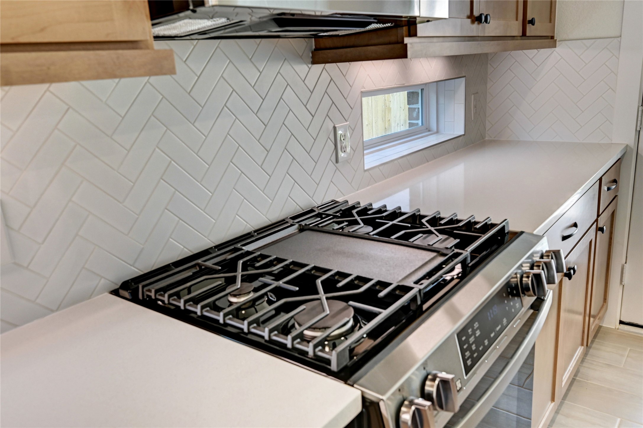 7643 Meadow Mouse Lane Katy, TX 77493 - Photo 9 of 35 a close up of a stove top oven sitting inside of a kitchen