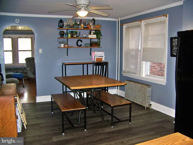 a view of a livingroom with furniture window and wooden floor