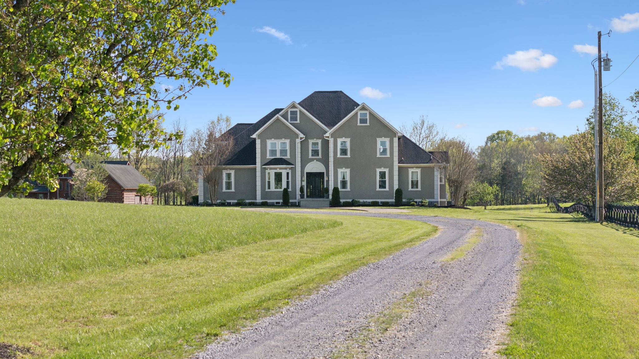422 Davis Road Lebanon, TN 37087 - Photo 1 of 87 a front view of a house with a yard and trees