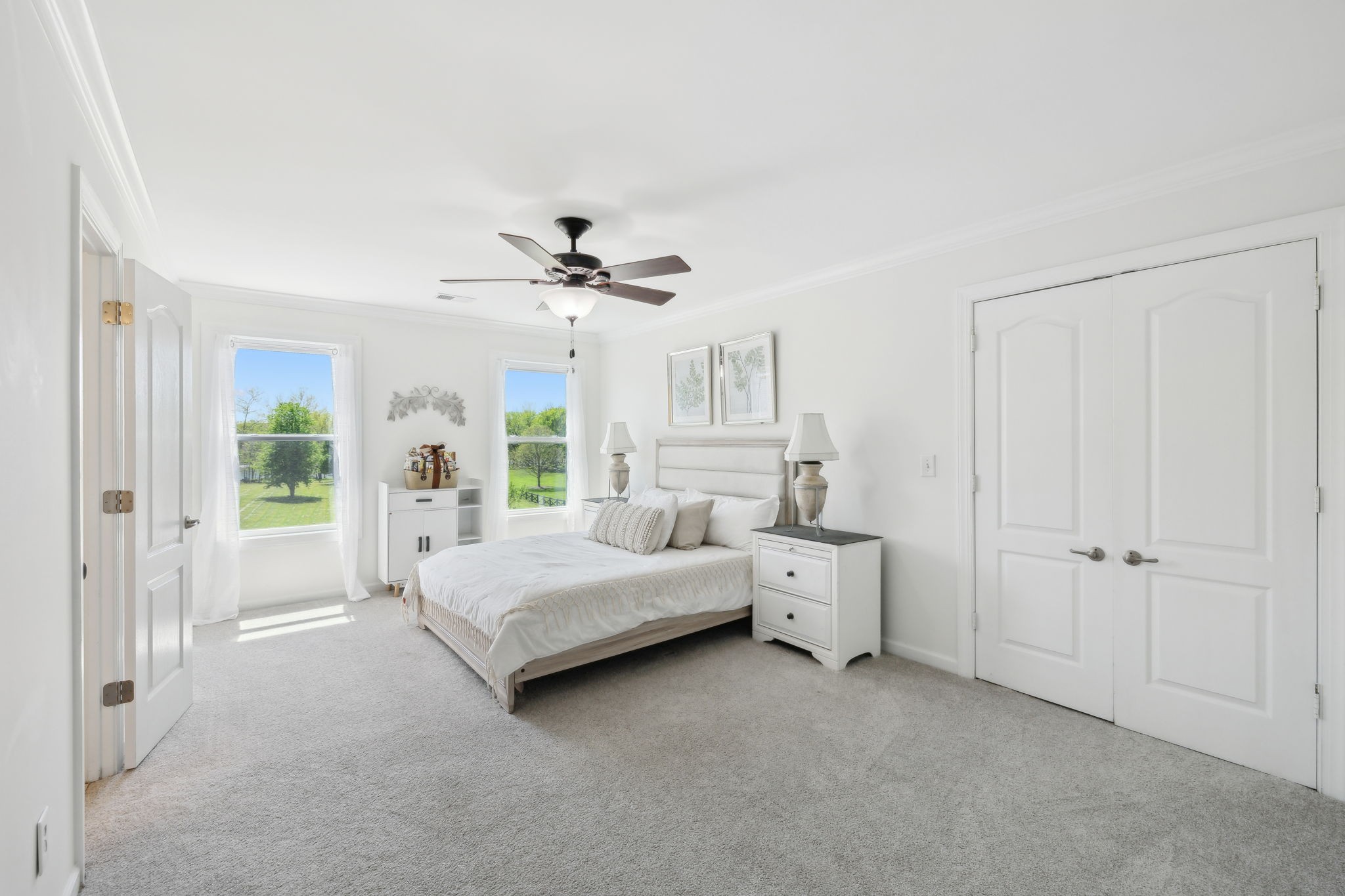 422 Davis Road Lebanon, TN 37087 - Photo 57 of 87 a spacious bedroom with a bed and a chandelier