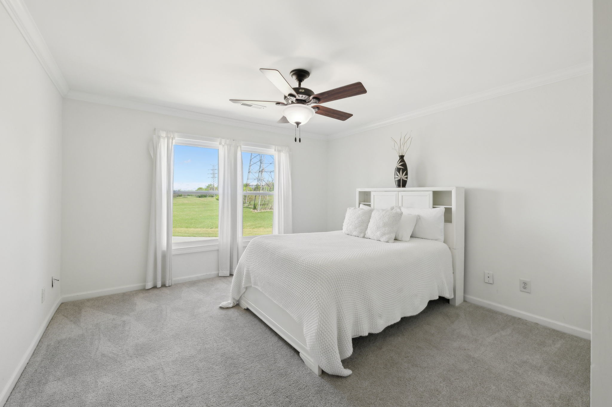 422 Davis Road Lebanon, TN 37087 - Photo 63 of 87 a spacious bedroom with a bed and a chandelier