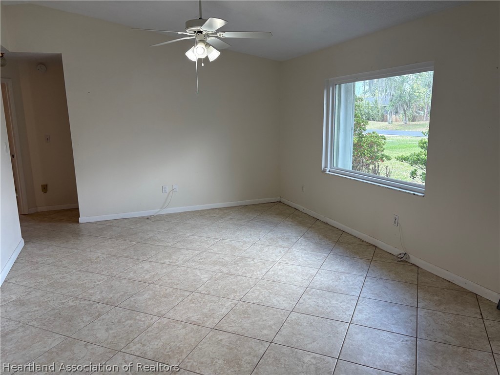 3913 Ferrari Drive Sebring, FL 33872 - Photo 5 of 20 a view of room with window and ceiling fan