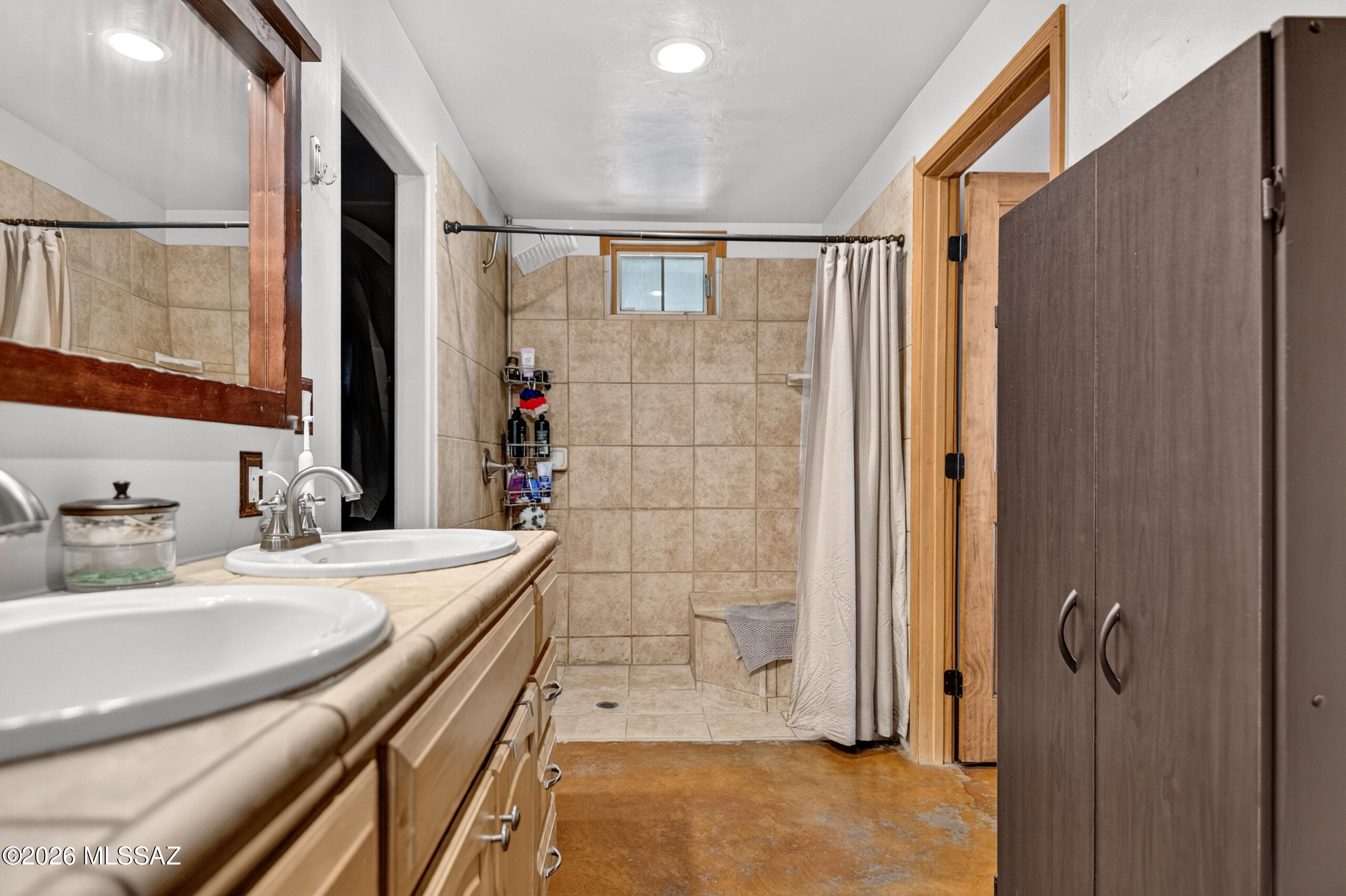 531 South Cody Loop Road Oracle, AZ 85623 - Photo 24 of 38 a bathroom with a sink and a mirror
