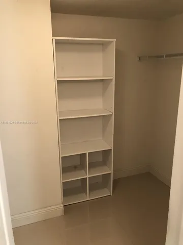 a view of an empty walk in closet