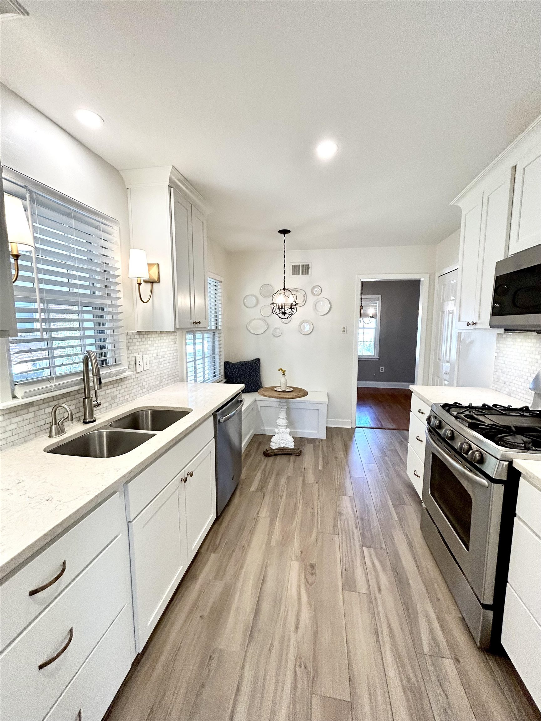 5197 Mason Road Memphis, TN 38117 - Photo 9 of 25 a large kitchen with a lot of white cabinets and stainless steel appliances