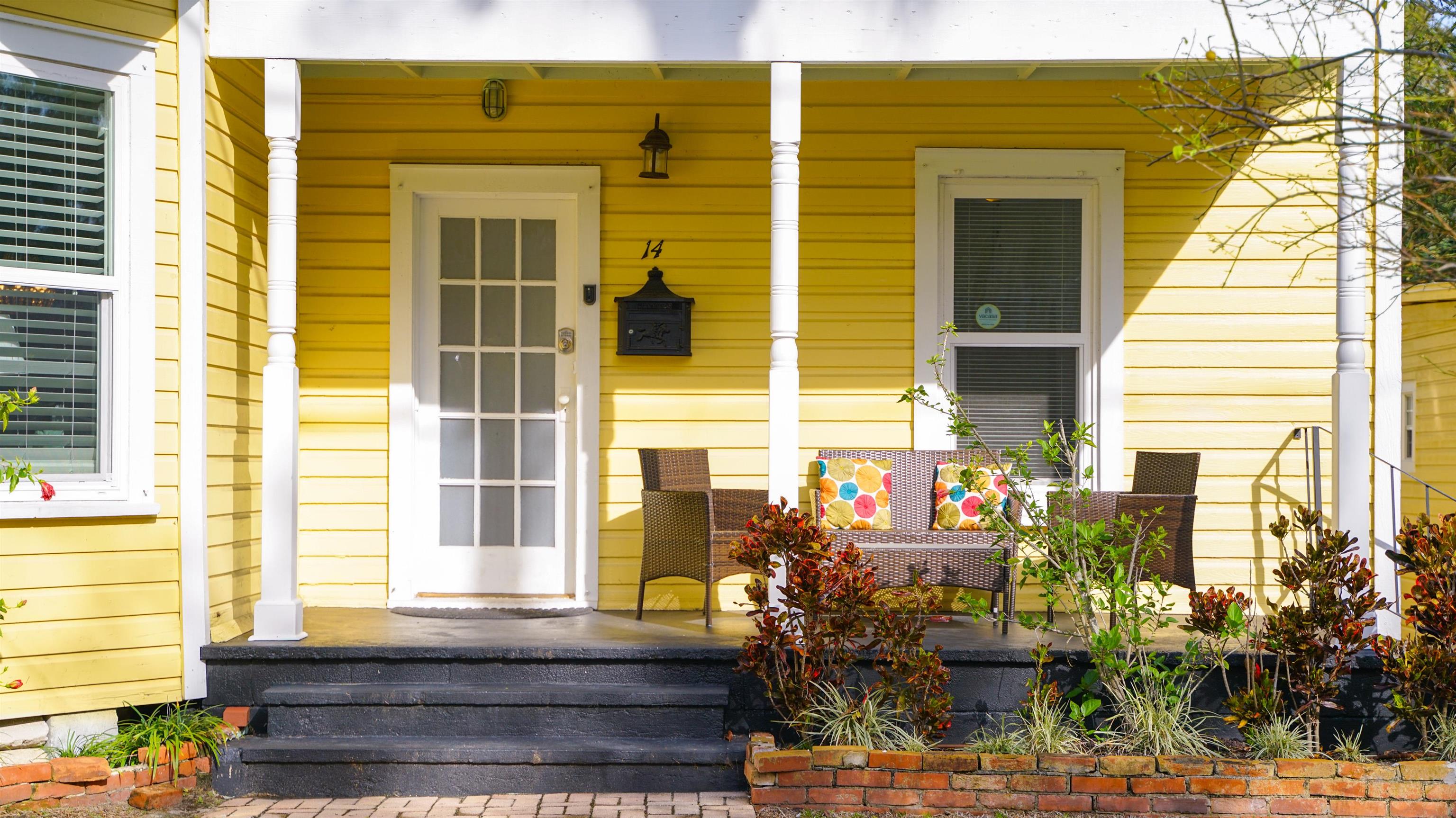 14 Sanchez Avenue, Unit B St. Augustine, FL 32084 - Photo 2 of 30 a front view of a house with a yard
