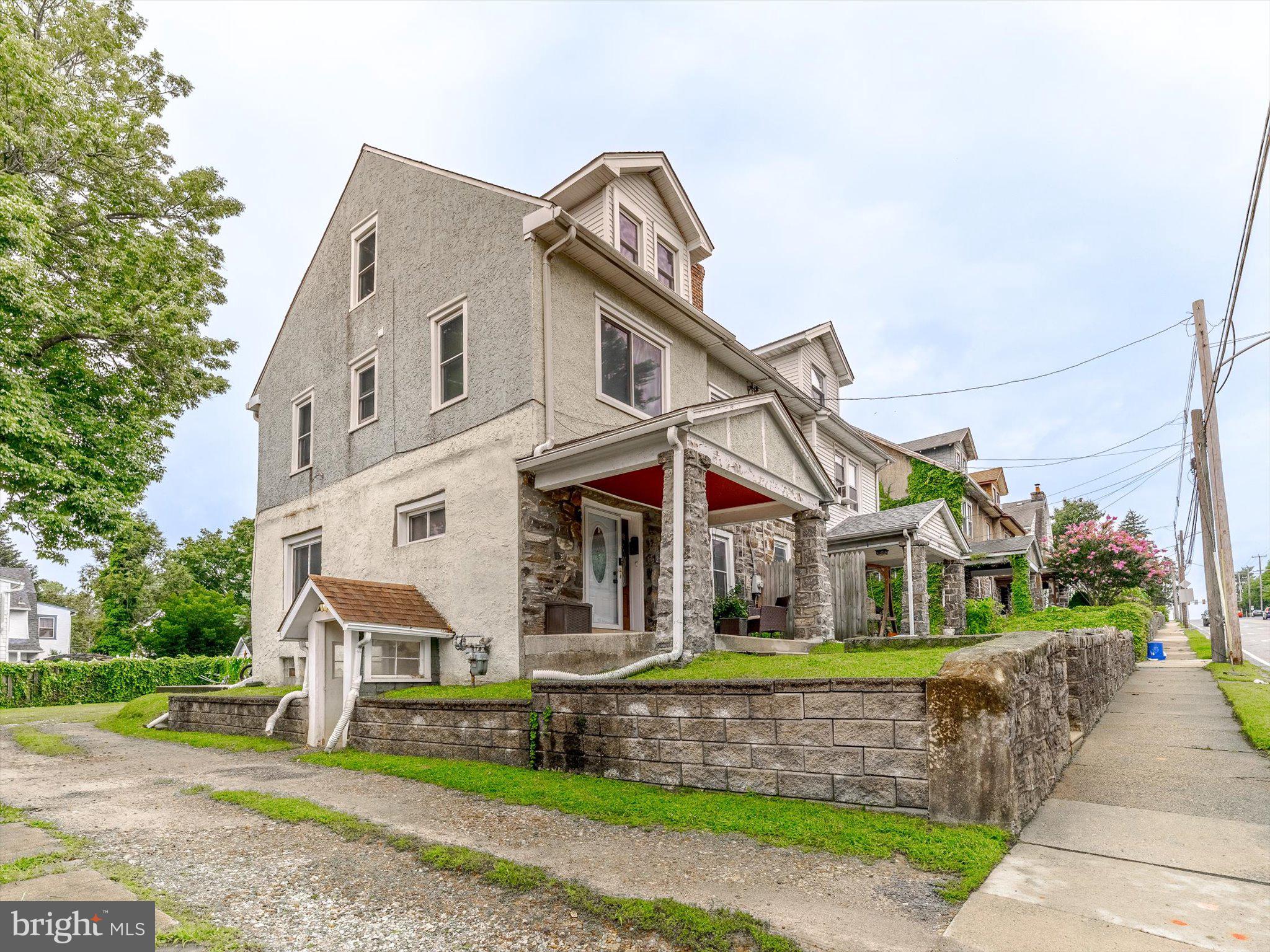 235 East Township Line Road Upper Darby, PA 19082 - Photo 3 of 26 a front view of a house with a garden