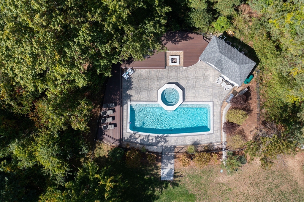 an aerial view of a house with a swimming pool