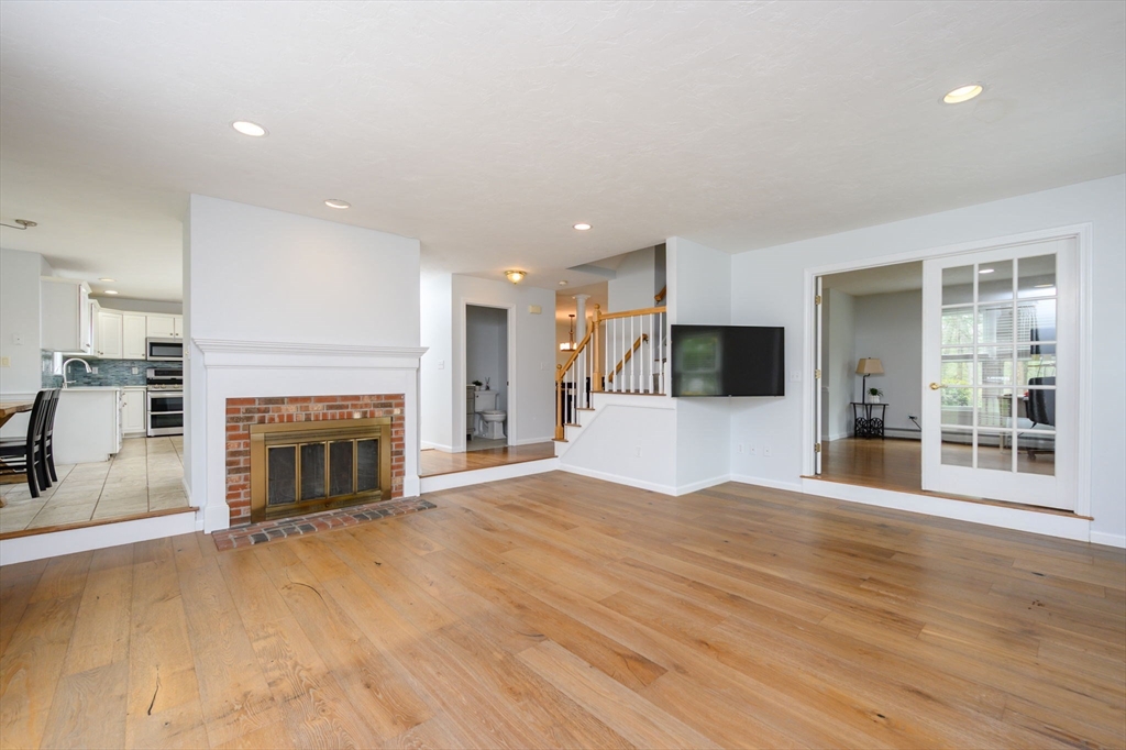 72 Pilgrim Trail Marshfield, MA 02050 - Photo 12 of 42 a view of a livingroom with an empty space and a fireplace