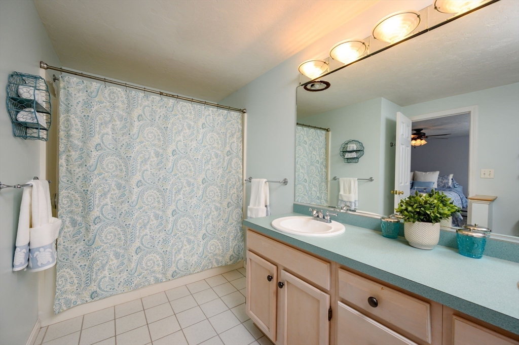 72 Pilgrim Trail Marshfield, MA 02050 - Photo 18 of 42 a bathroom with a granite countertop sink a toilet and shower