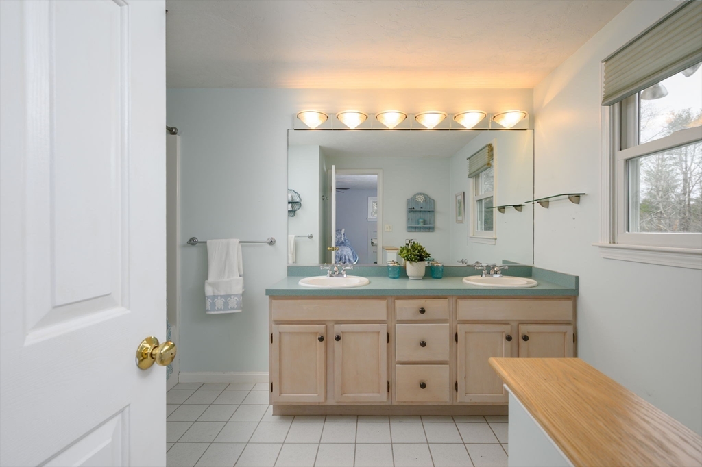 72 Pilgrim Trail Marshfield, MA 02050 - Photo 19 of 42 a bathroom with a sink a mirror and a vanity