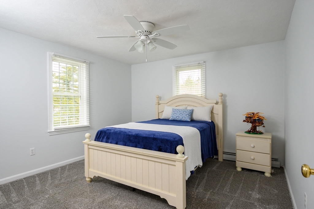 72 Pilgrim Trail Marshfield, MA 02050 - Photo 20 of 42 a spacious bedroom with a bed and a window
