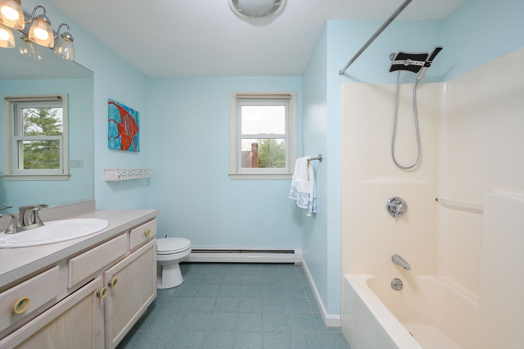 72 Pilgrim Trail Marshfield, MA 02050 - Photo 21 of 42 a bathroom with a granite countertop sink a toilet and shower