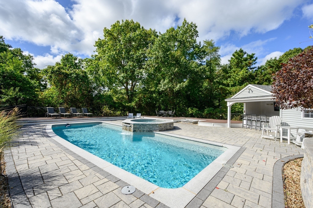 72 Pilgrim Trail Marshfield, MA 02050 - Photo 32 of 42 a view of a swimming pool with a patio