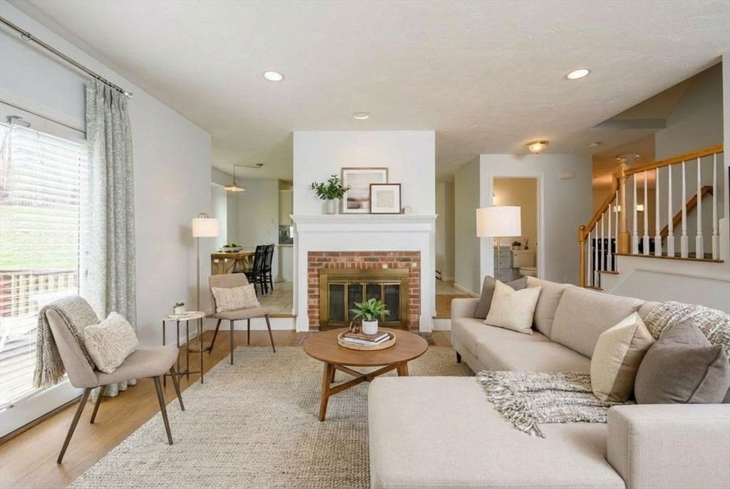 72 Pilgrim Trail Marshfield, MA 02050 - Photo 10 of 42 a living room with furniture and a fireplace