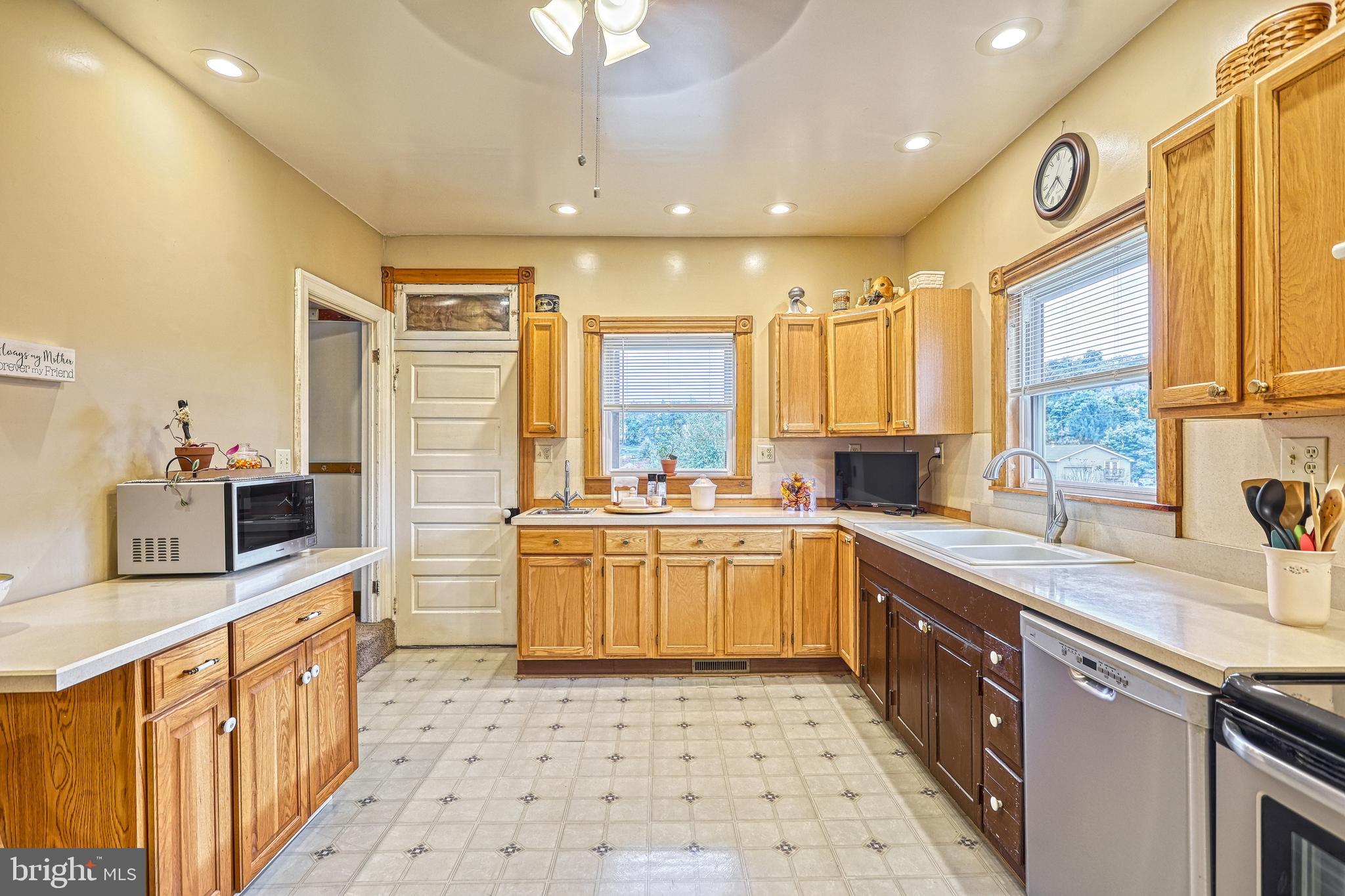 3 West High Street Windsor, PA 17366 - Photo 44 of 63 a large kitchen with stainless steel appliances a sink a stove a counter space and cabinets