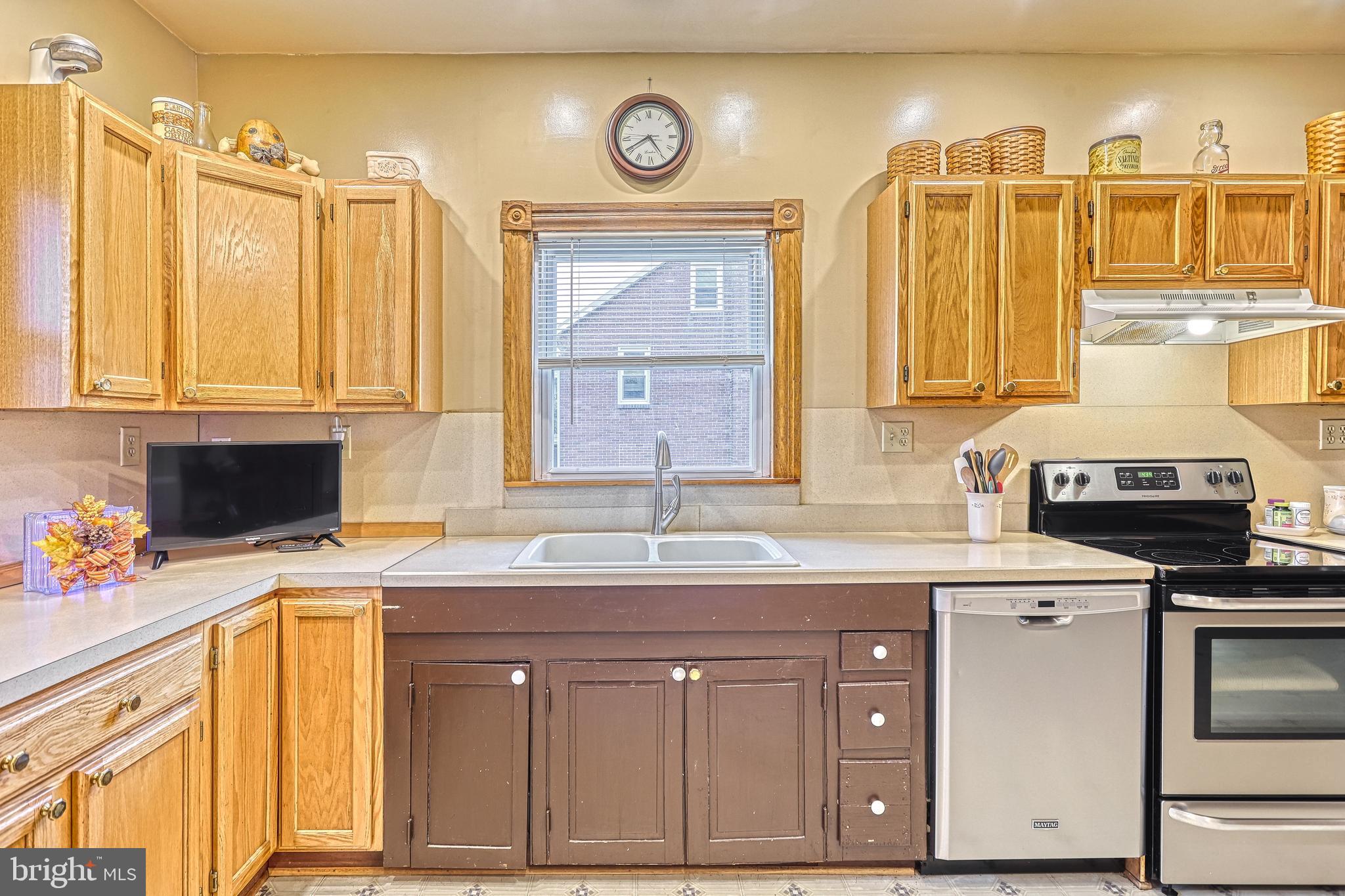 3 West High Street Windsor, PA 17366 - Photo 54 of 63 a kitchen with stainless steel appliances granite countertop a sink stove and cabinets