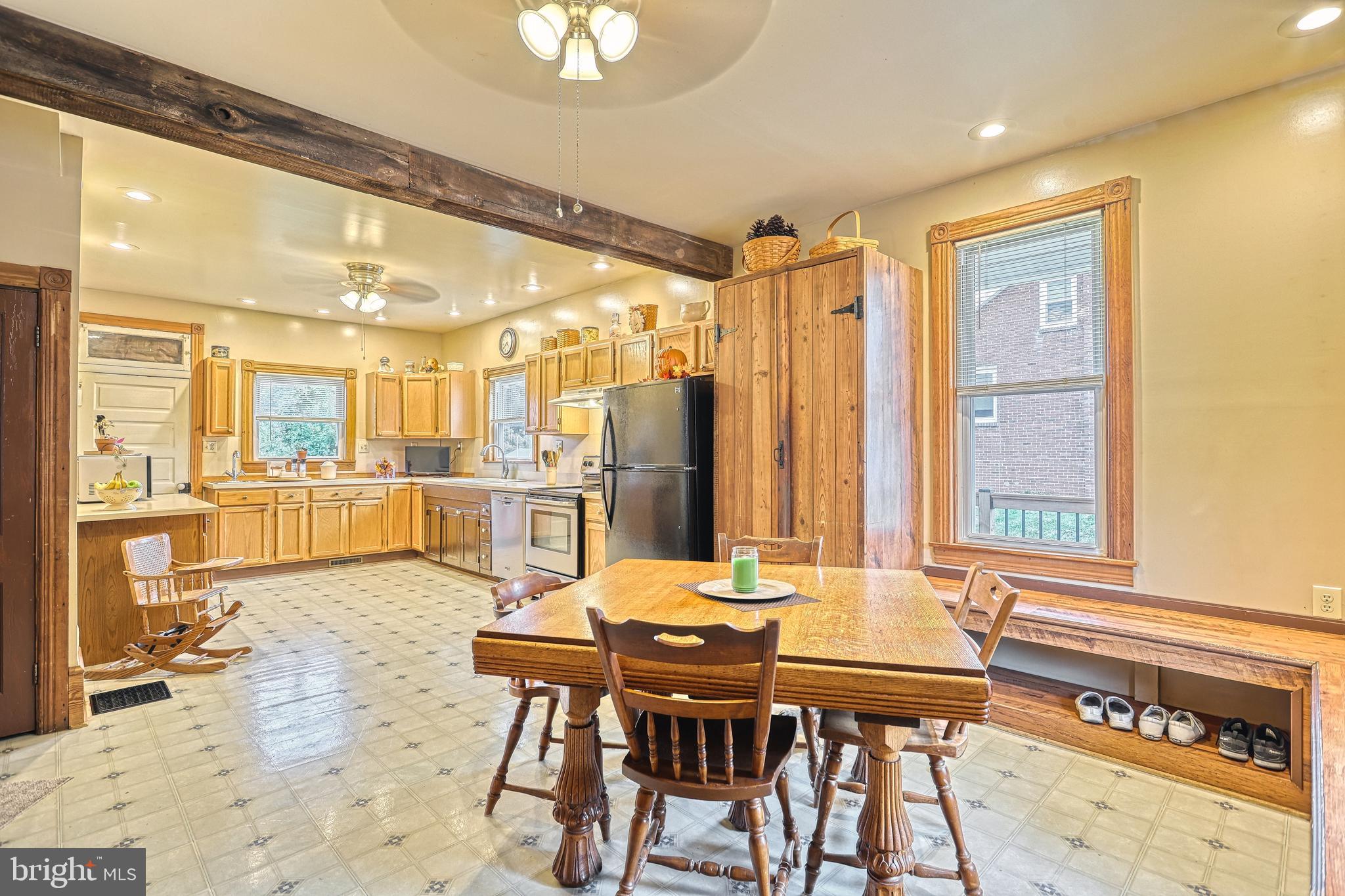 3 West High Street Windsor, PA 17366 - Photo 55 of 63 a view of a dining room and livingroom with furniture wooden floor and a chandelier