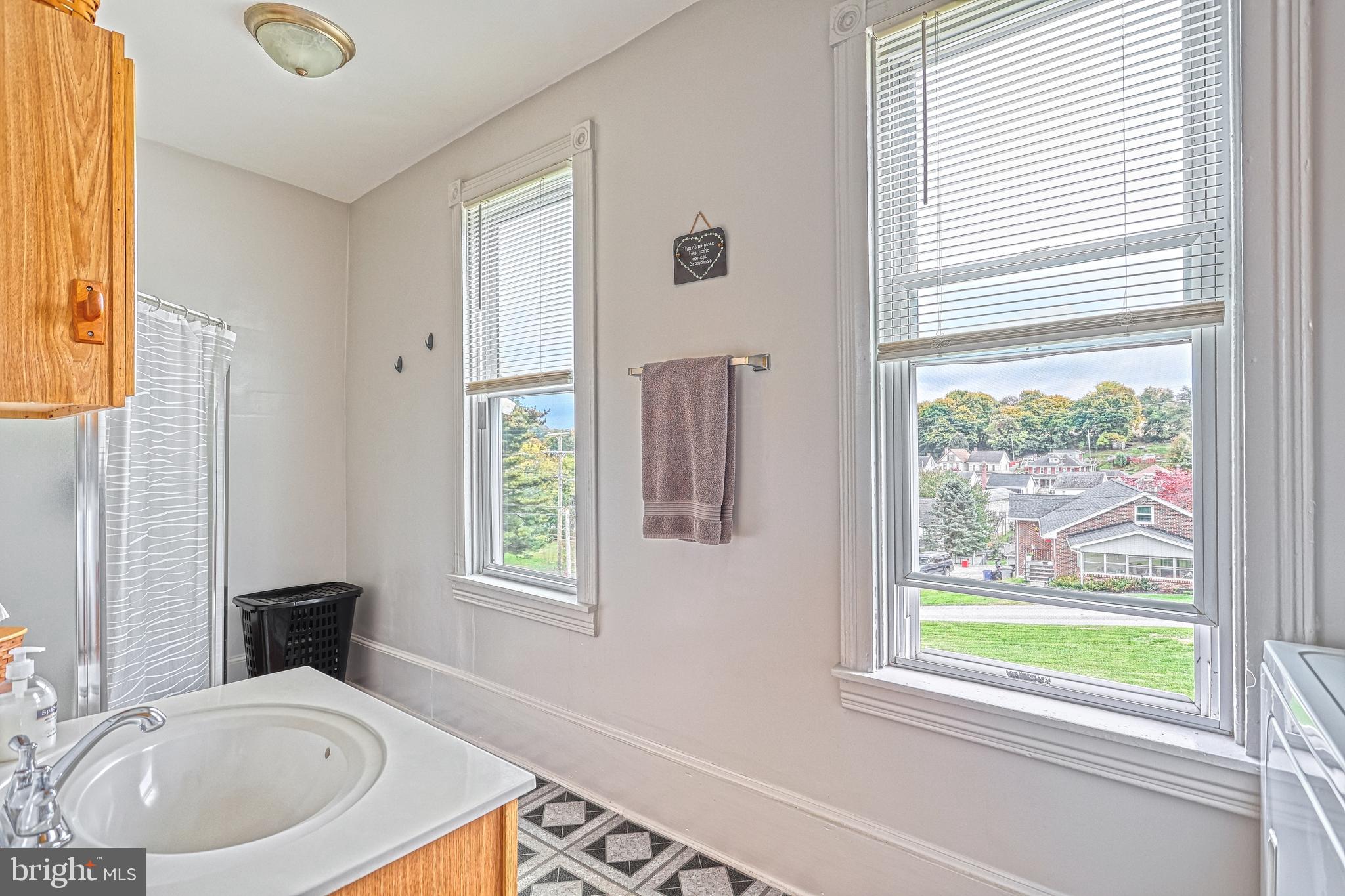 3 West High Street Windsor, PA 17366 - Photo 56 of 63 a bathroom with a sink a bathtub and a window
