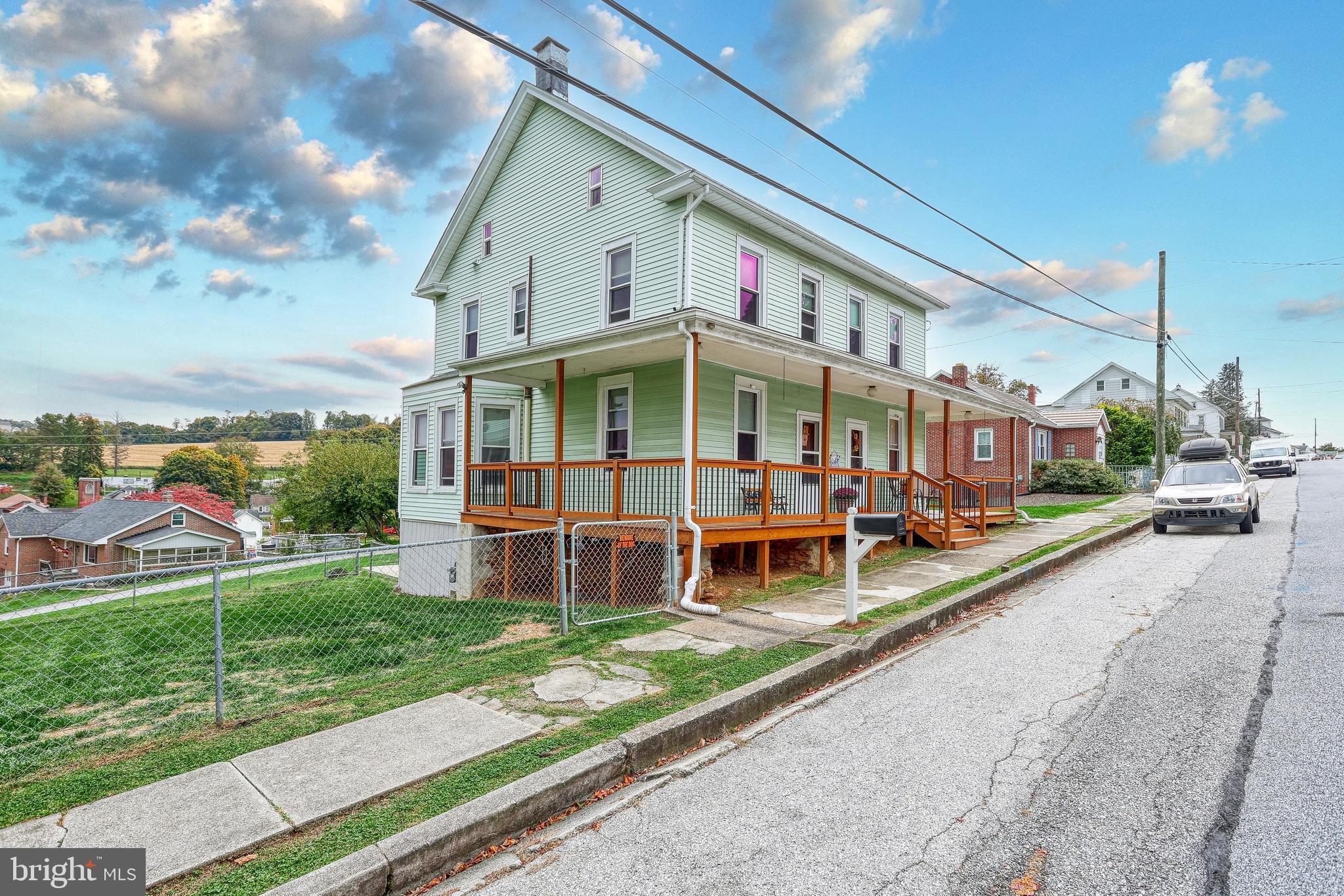 3 West High Street Windsor, PA 17366 - Photo 6 of 63 a view of a house with a yard and sitting area