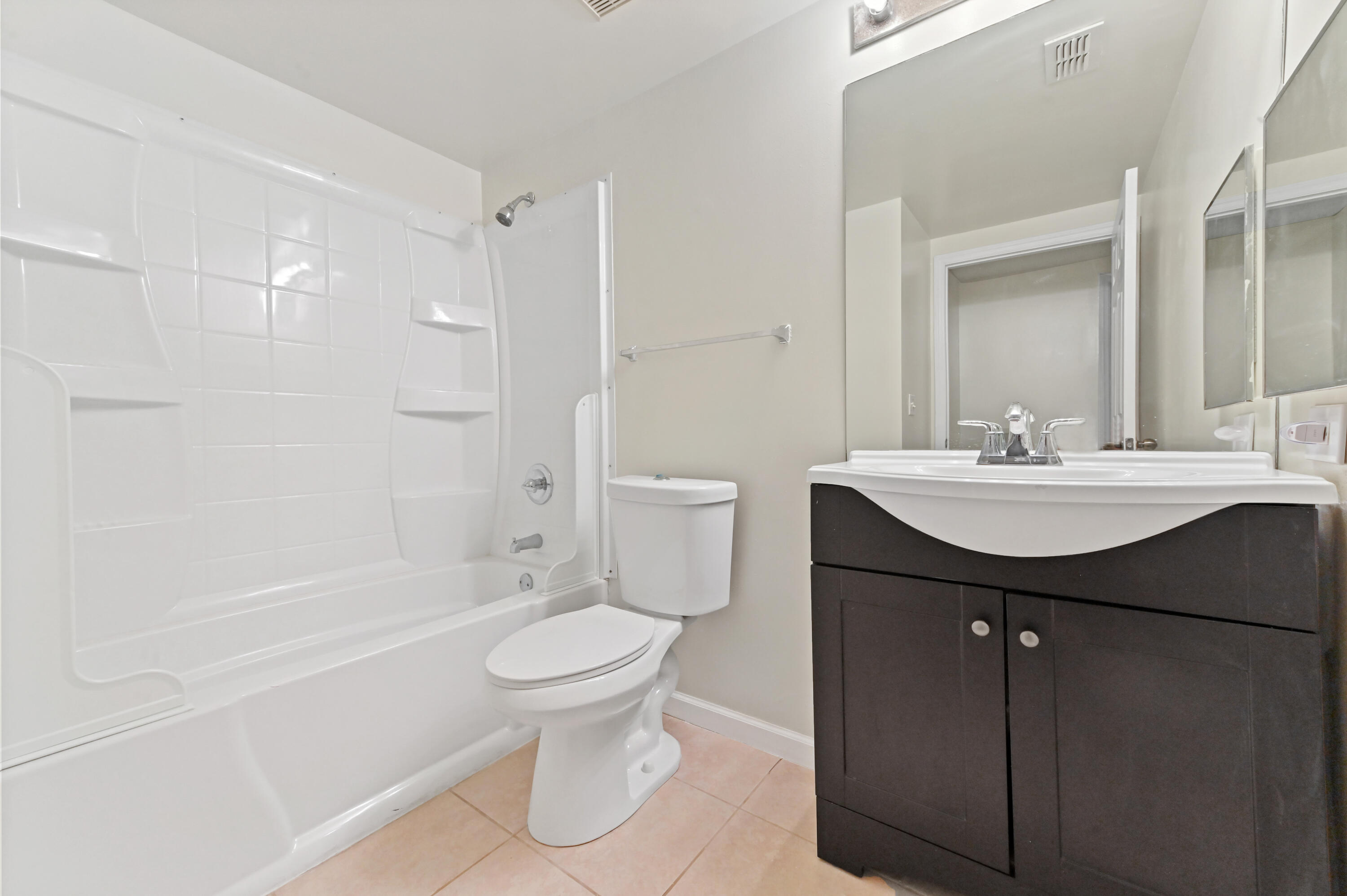 10306 Fox Trail Road South, Unit 906 West Palm Beach, FL 33411 - Photo 14 of 26 a bathroom with a sink toilet and shower
