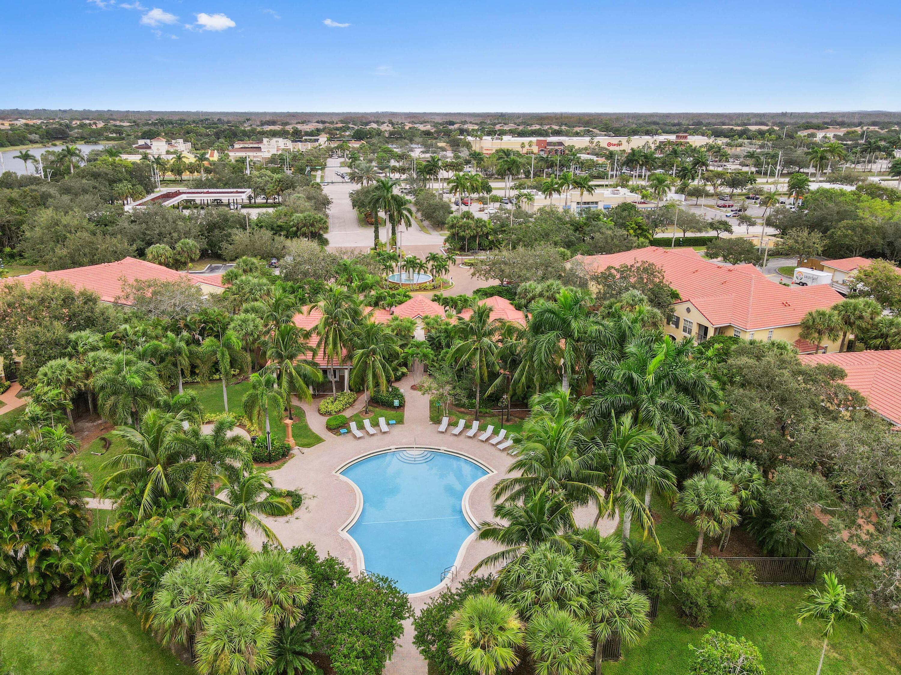 10306 Fox Trail Road South, Unit 906 West Palm Beach, FL 33411 - Photo 22 of 26 an aerial view of residential houses with outdoor space and river