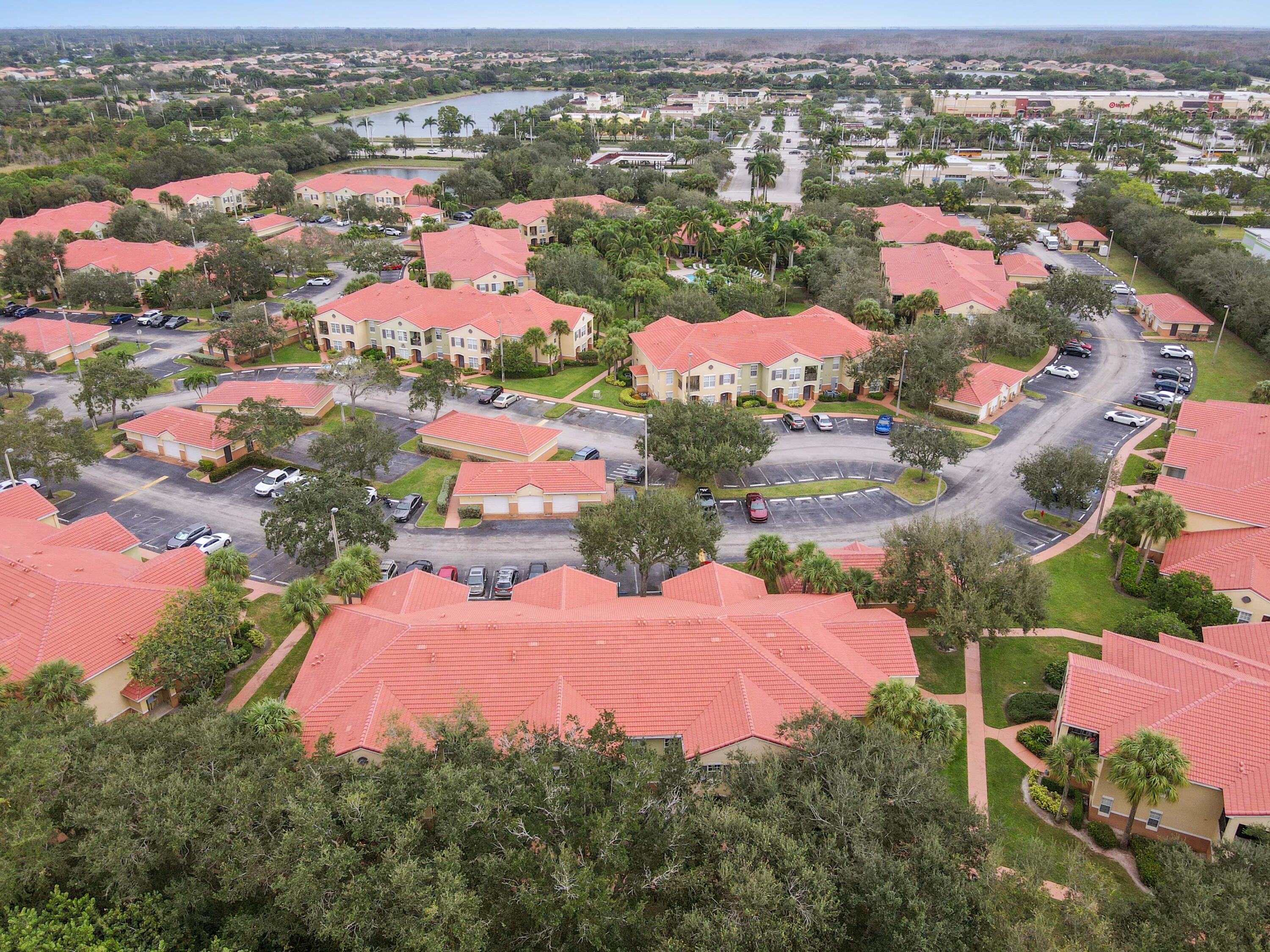 10306 Fox Trail Road South, Unit 906 West Palm Beach, FL 33411 - Photo 24 of 26 an aerial view of residential houses with outdoor space