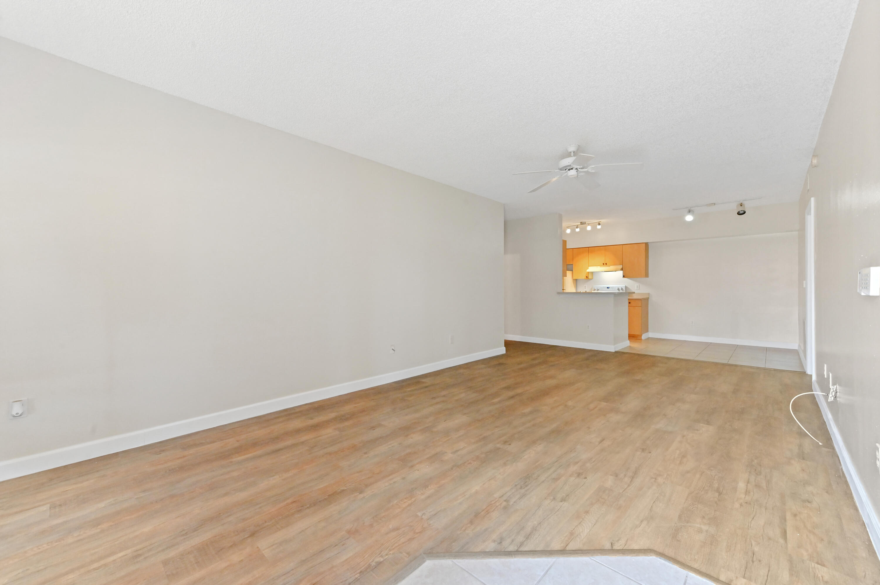 10306 Fox Trail Road South, Unit 906 West Palm Beach, FL 33411 - Photo 4 of 26 a view of an empty room and a window