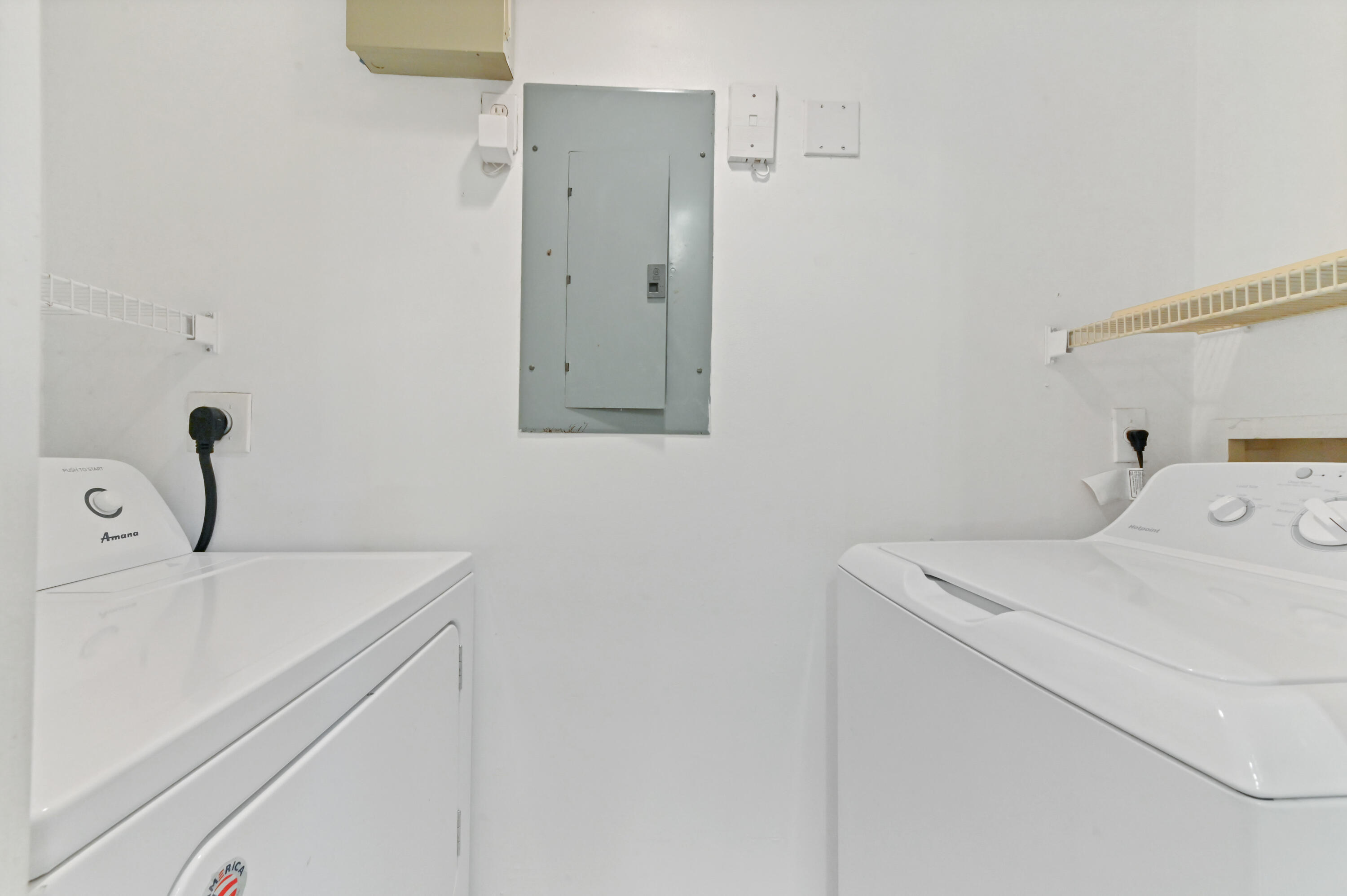 10306 Fox Trail Road South, Unit 906 West Palm Beach, FL 33411 - Photo 10 of 26 a utility room with dryer and washer