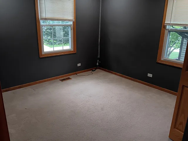 an empty room with windows
