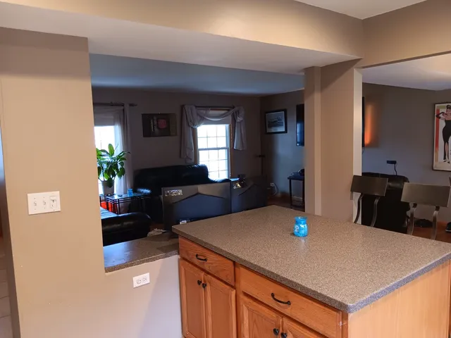 a kitchen with a table and chairs