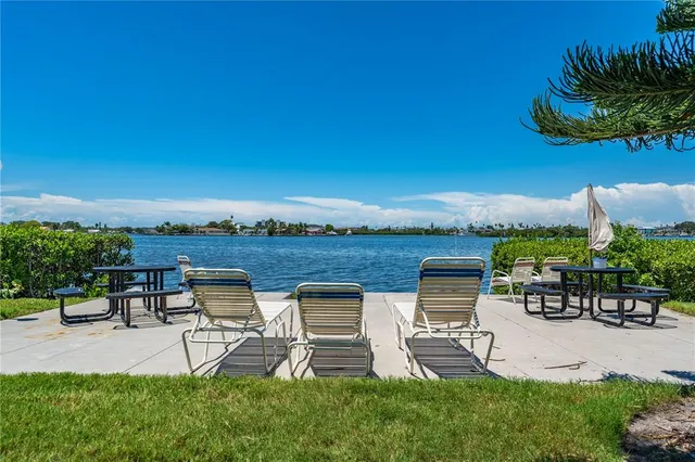 a view of a patio with chairs and table