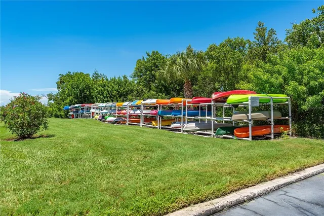 a view of an house with swimming pool and yard