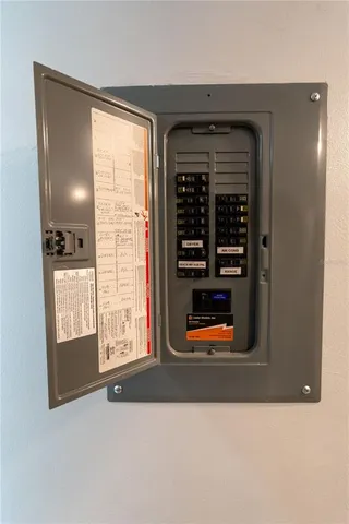 a front view of a building with trees