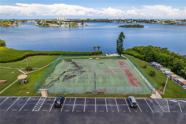 an aerial view of a house with a lake view